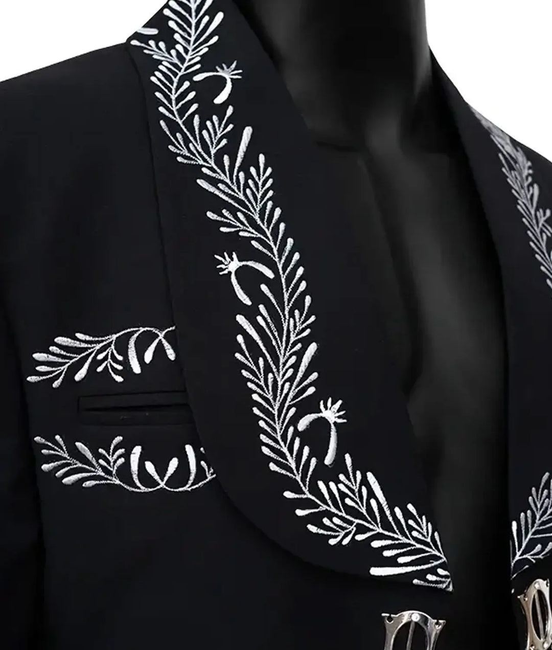 Black blazer with white floral embroidery on a mannequin