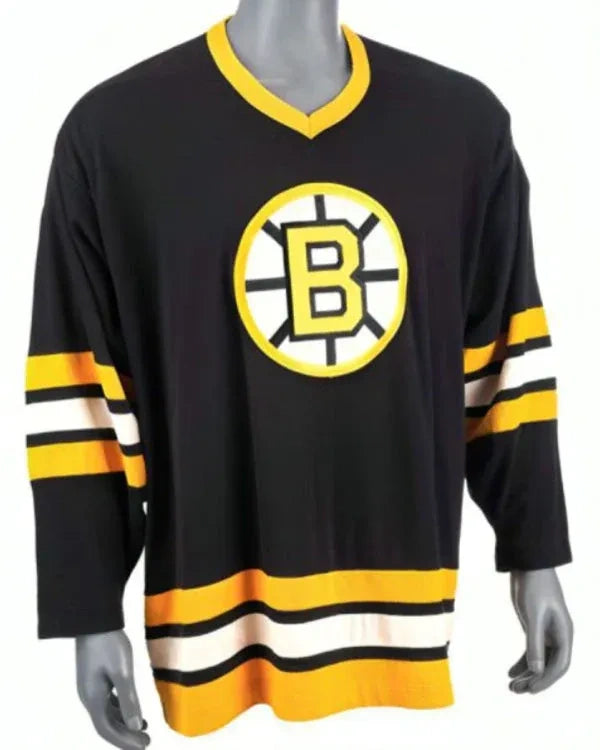 Black hockey jersey with yellow and white accents featuring a logo on a mannequin.