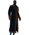 Long black coat with brown trim on a mannequin against a white background