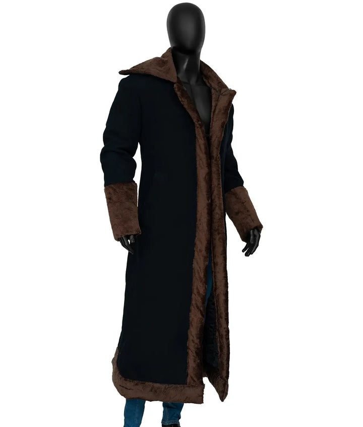 Long black coat with brown trim on a mannequin against a white background