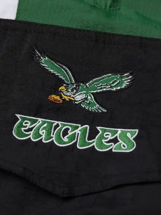 Black jacket with green eagle logo and 'Eagles' text on a green background