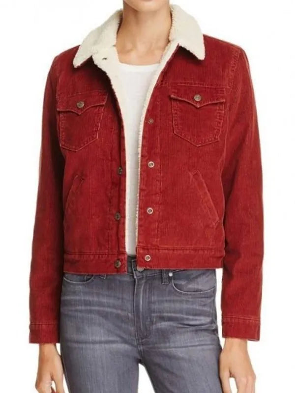 Red denim jacket with white fur collar worn by a person on a white background