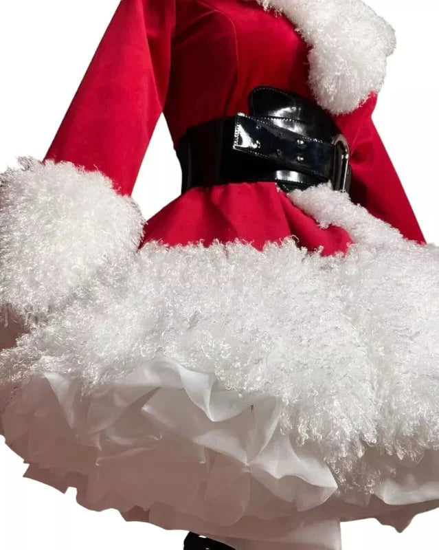 Close-up of a red Santa Claus outfit with white fur trim on a white background